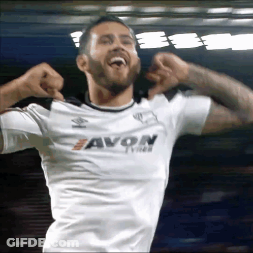 A Man Wearing A White Shirt That Says Avon Tyres GIF