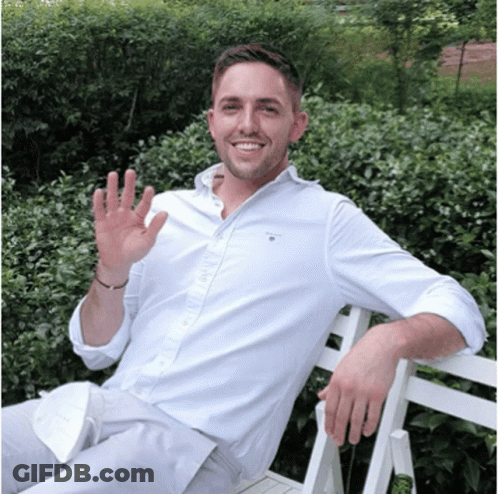 A Man Wearing A White Shirt That Says Gant On The Front GIF