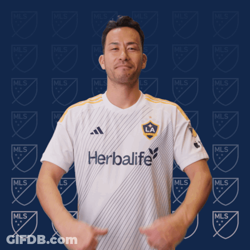 A Man Wearing A White Shirt That Says Herbalife GIF