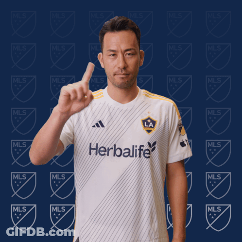 A Man Wearing A White Shirt That Says Herbalife GIF