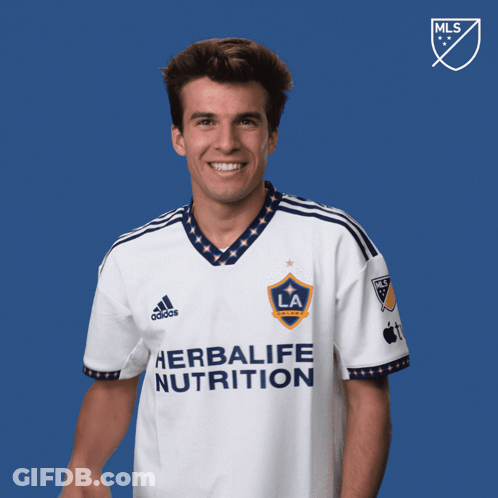 A Man Wearing A White Shirt That Says Herbalife Nutrition GIF