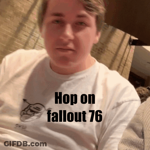 A Man Wearing A White Shirt That Says Hop On Fallout 76 On It GIF