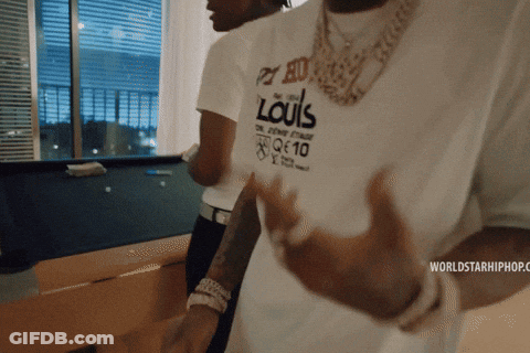 A Man Wearing A White Shirt That Says Louis GIF