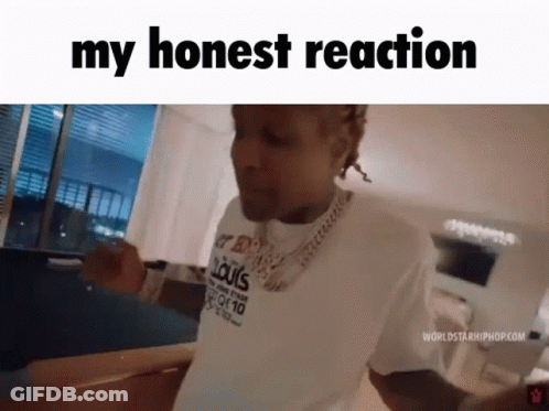 A Man Wearing A White Shirt That Says Louis Vuitton Is Standing In A Living Room . GIF