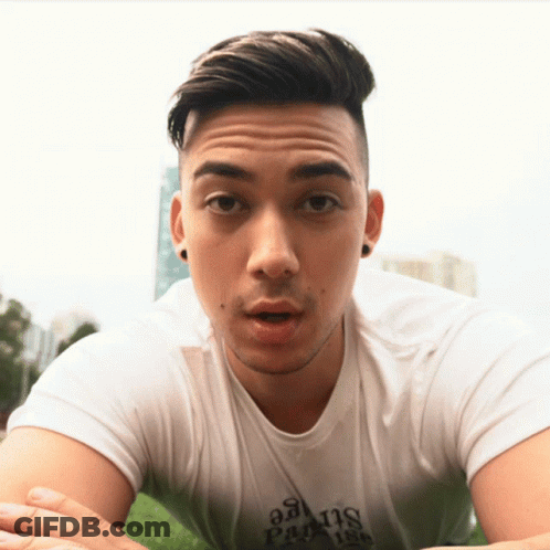 A Man Wearing A White Shirt That Says Paradise GIF