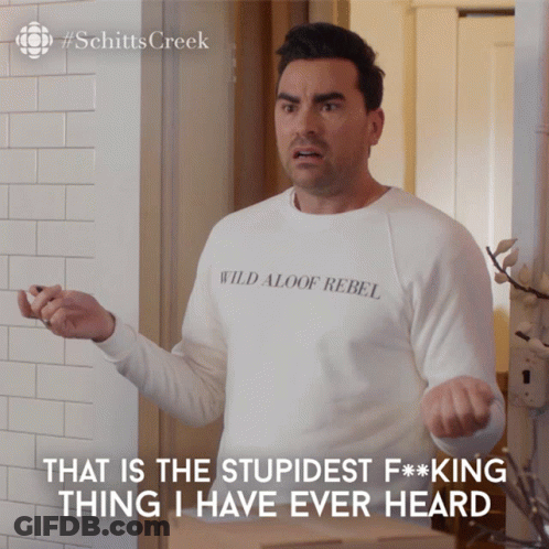 A Man Wearing A White Shirt That Says Wild Aloof Rebel On It GIF