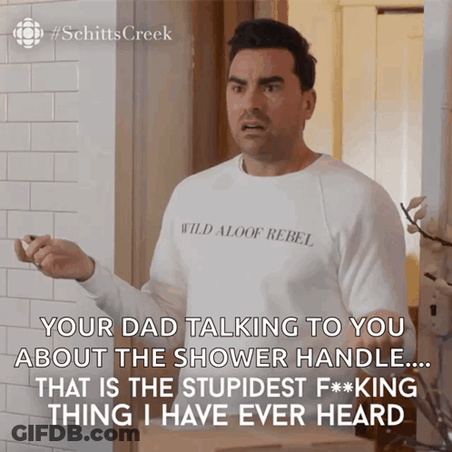 A Man Wearing A White Shirt That Says Wild Aloof Rebel On It GIF