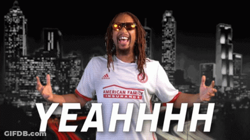 A Man Wearing A White Shirt That Says Yeahhhh GIF