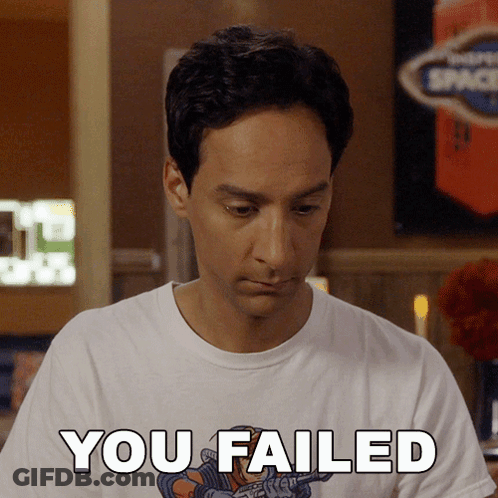 A Man Wearing A White Shirt That Says " You Failed " GIF