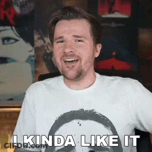 A Man Wearing A White Shirt With A Picture Of A Man On It Says " I Kinda Like It " GIF