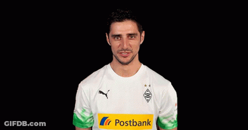 A Man Wearing A White Shirt With A Yellow Postbank Logo GIF