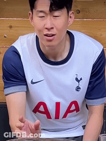 A Man Wearing A White Shirt With Aia On The Front GIF