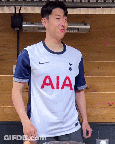 A Man Wearing A White Shirt With Aia Written On It GIF