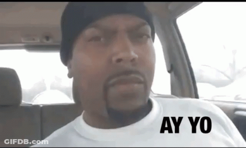 A Man Wearing A White Shirt With Ay Yo Written On It GIF