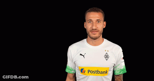 A Man Wearing A White Shirt With Postbank On The Front GIF