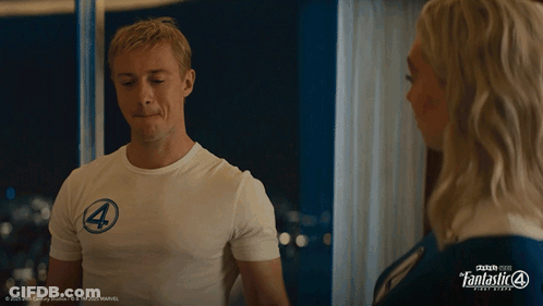 A Man Wearing A White Shirt With The Number 4 On It Stands Next To A Woman GIF