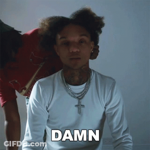 A Man Wearing A White Shirt With The Word Damn Written On It GIF