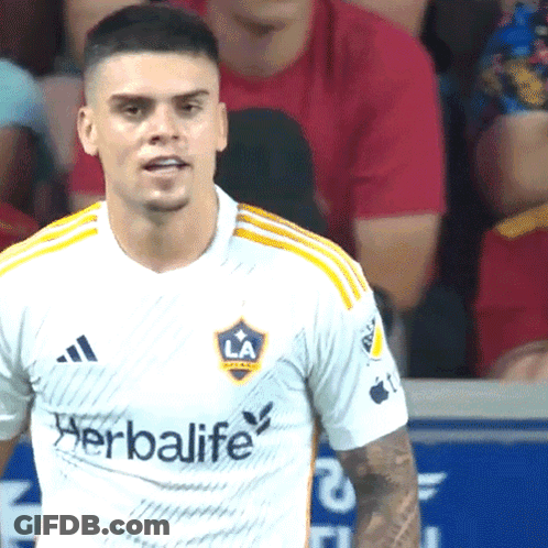 A Man Wearing A White Shirt With The Word Herbalife On The Front GIF