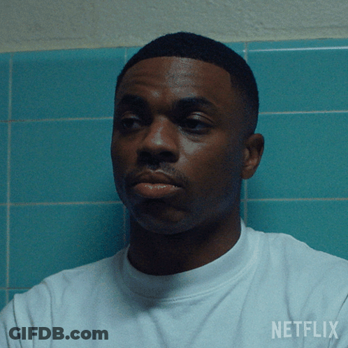 A Man Wearing A White Shirt With The Word Netflix On The Back GIF