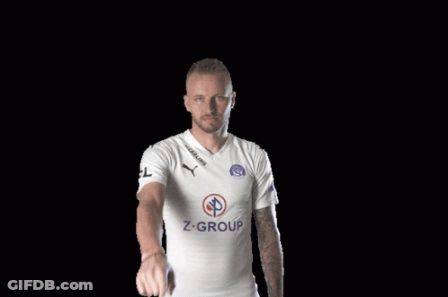 A Man Wearing A White Shirt With Z-Group On The Front GIF