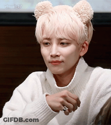 A Man Wearing A White Sweater And A Teddy Bear Headband GIF
