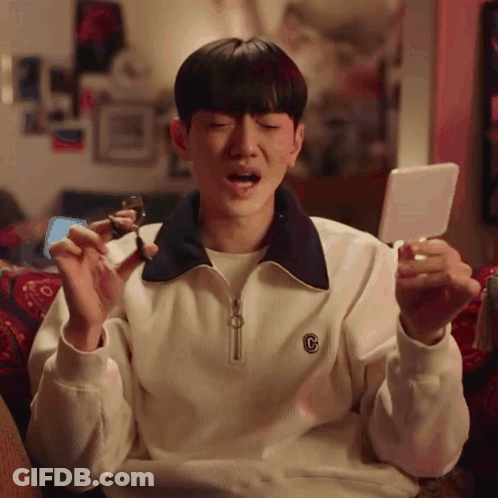 A Man Wearing A White Sweater With The Letter C On It GIF