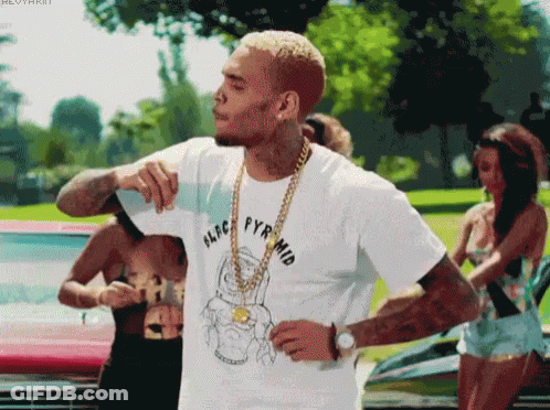 A Man Wearing A White T-Shirt That Says Aldc Pyrmid GIF