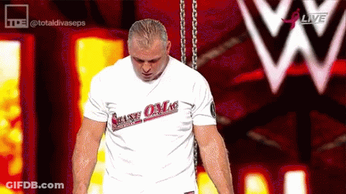 A Man Wearing A White T-Shirt That Says Make Love GIF