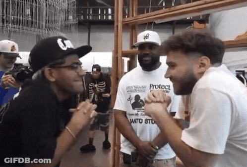 A Man Wearing A White T-Shirt That Says Protect On It GIF