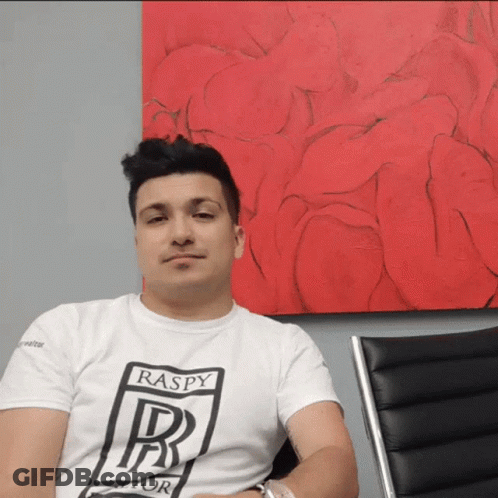 A Man Wearing A White T-Shirt That Says Raspy On It GIF