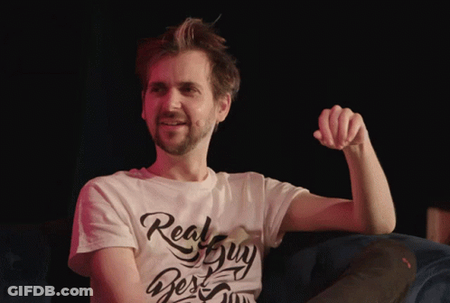 A Man Wearing A White T-Shirt That Says Real Guy On It GIF