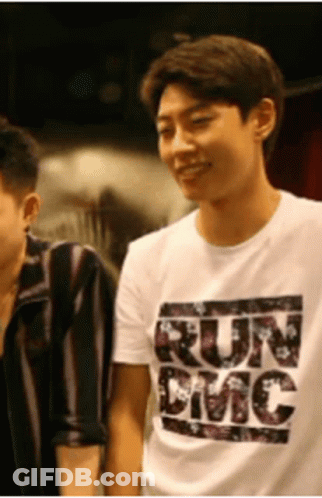 A Man Wearing A White T-Shirt That Says Run Emc GIF