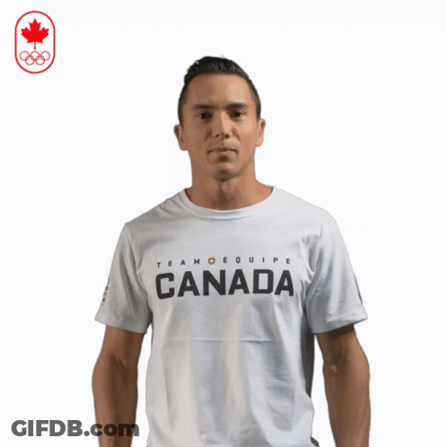 A Man Wearing A White T-Shirt That Says Team Equipe Canada GIF