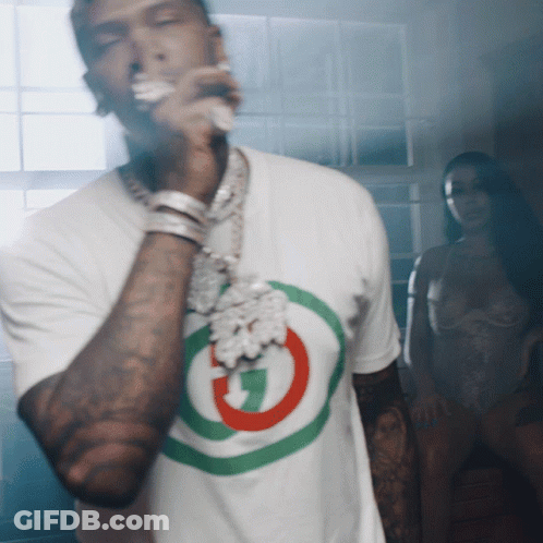 A Man Wearing A White T-Shirt With A G On It GIF