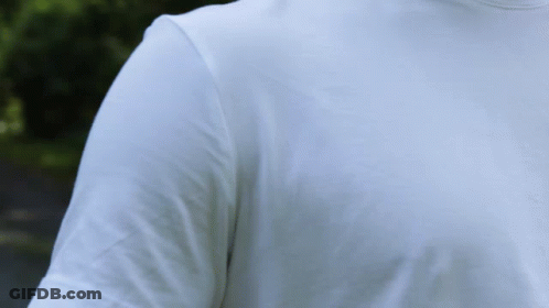A Man Wearing A White T-Shirt With Long Sleeves And A Turtleneck GIF