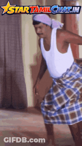 A Man Wearing A White Tank Top And A Plaid Skirt Is Dancing In Front Of A Star Tamilchat.in Logo GIF