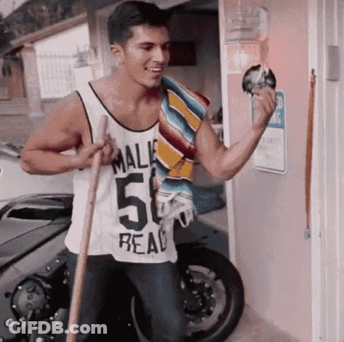 A Man Wearing A White Tank Top That Says Mali 50 Real GIF