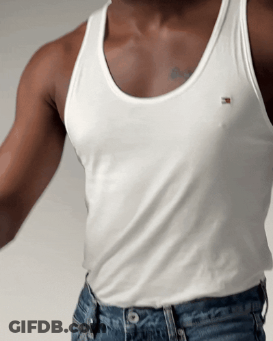A Man Wearing A White Tank Top With A Tommy Hilfiger Logo On It GIF