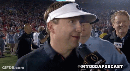 A Man Wearing A White Visor Is Talking Into A Espn Radio Microphone GIF