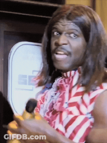 A Man Wearing A Wig And A Red White And Blue Striped Shirt Is Holding A Banana GIF