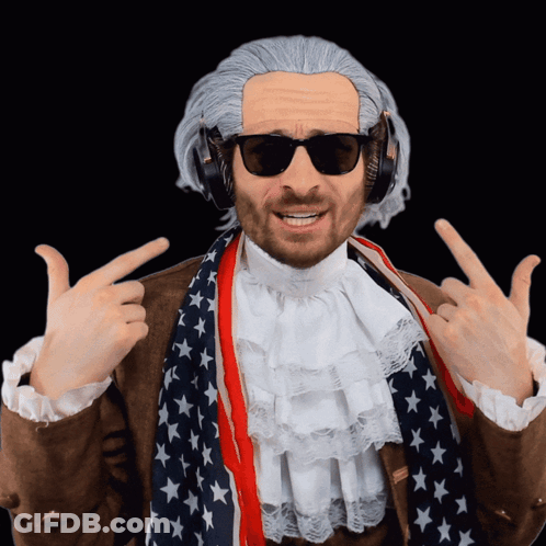 A Man Wearing A Wig And Headphones Is Pointing Up GIF