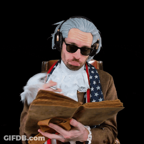 A Man Wearing A Wig And Headphones Is Reading A Book GIF