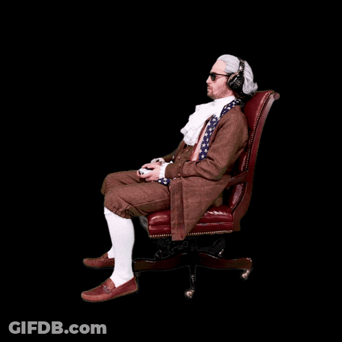 A Man Wearing A Wig And Headphones Is Sitting In An Office Chair Playing A Video Game GIF