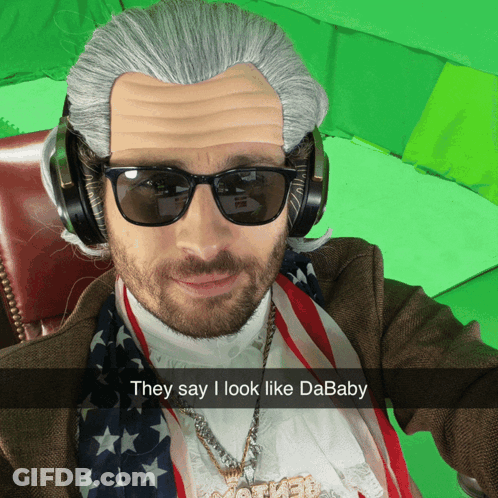 A Man Wearing A Wig And Sunglasses Has A Caption That Says " They Say I Look Like Dababy " GIF