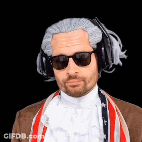 A Man Wearing A Wig And Sunglasses Has A Pair Of Headphones On His Head GIF
