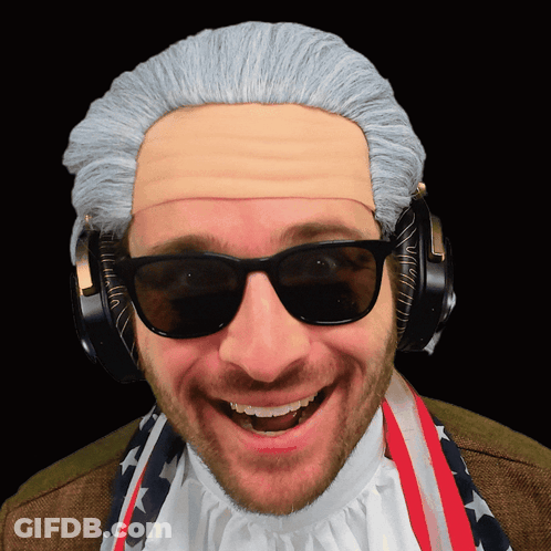 A Man Wearing A Wig And Sunglasses Has Headphones On GIF