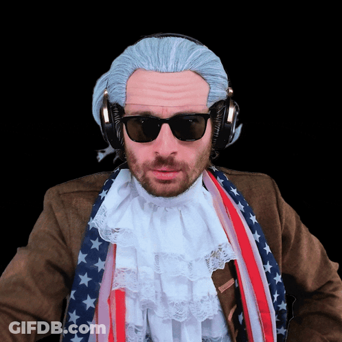 A Man Wearing A Wig And Sunglasses Has Headphones On GIF