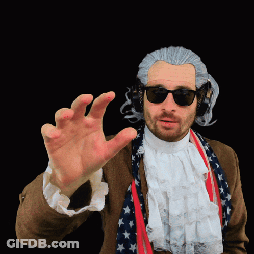 A Man Wearing A Wig And Sunglasses Has His Hand Out GIF
