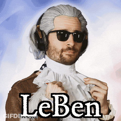 A Man Wearing A Wig And Sunglasses Has The Word Leben On His Shirt GIF