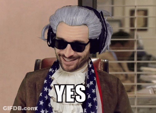 A Man Wearing A Wig And Sunglasses Has The Word Yes On His Chest GIF